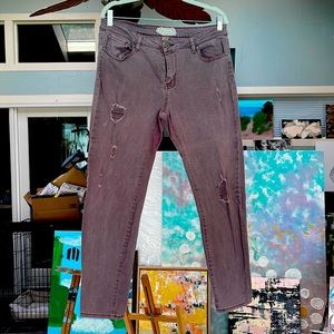 Faded vintage style distressed jeans